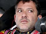 WATKINS GLEN, NY - AUGUST 08:  Tony Stewart, driver of the #14 Rush Truck Centers/Mobil 1 Chevrolet, sits in his car during practice for the NASCAR Sprint Cup Series Cheez-It 355 at Watkins Glen International on August 8, 2014 in Watkins Glen, New York.  (Photo by Jerry Markland/Getty Images)